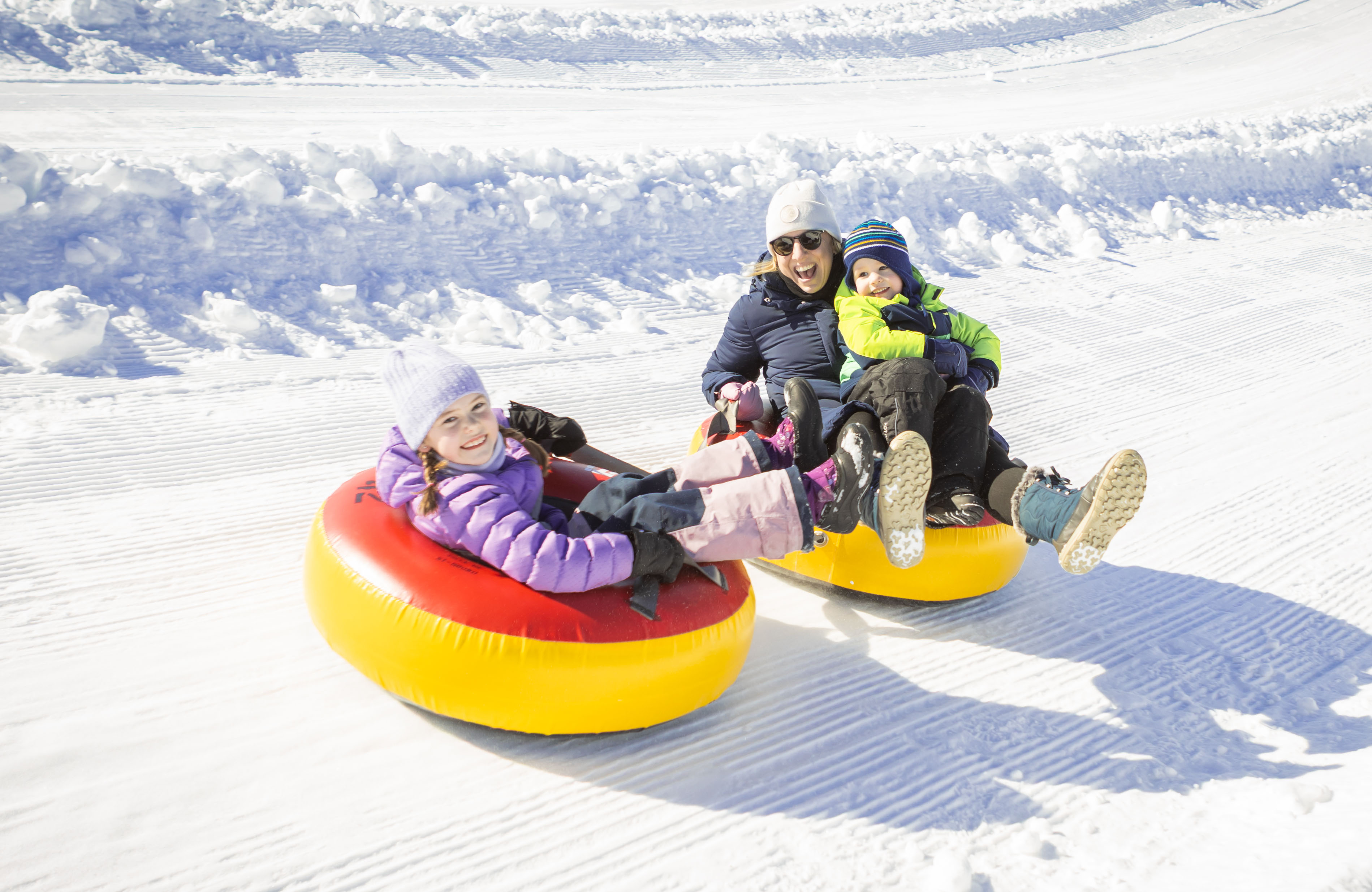 Kids in cozy fall jackets near a lake